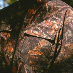 Malbon X 100 Thieves Woodsman Zip Off Windbreaker -Elite Wear Shop Untitleddesign 113